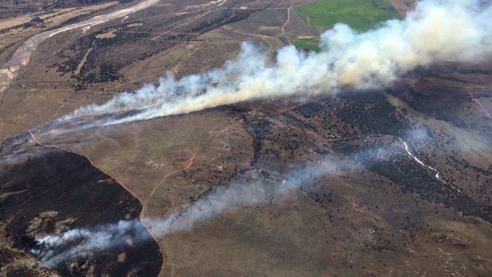 Officials wildfires caused by power lines, continue to burn, 20