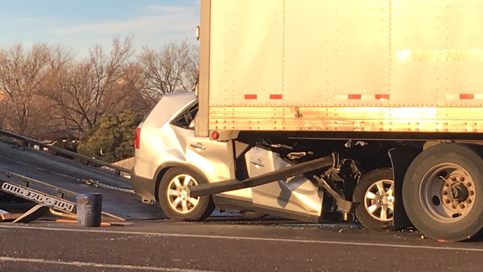 SUV gets trapped under semitruck KVII