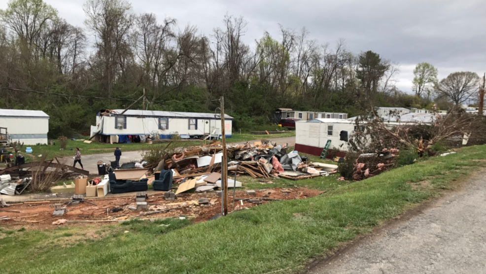 Mobile home park community working together to clean up after tornado
